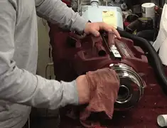 Vacuum repair technician cleaning and servicing a vacuum motor in San Francisco, CA