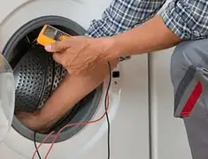 Washing machine repair technician testing a front-load washer with diagnostic tools in San Francisco, CA